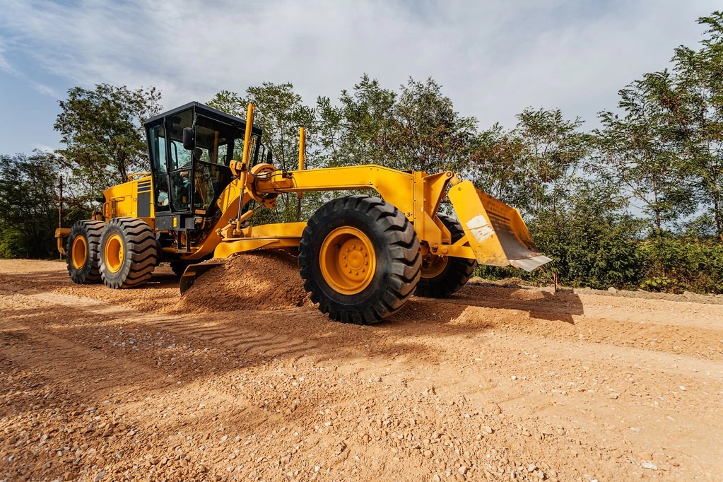 stock-photo-road-making-site-with-motor-grader 