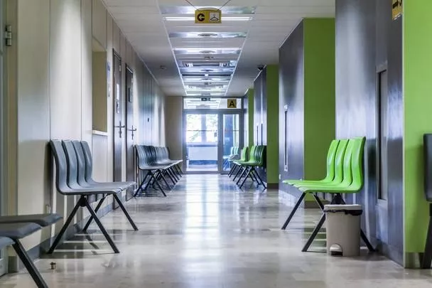 stock-photo-corridor-with-chairs-for-patients